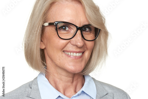 Beautiful senior business woman in eyeglasses