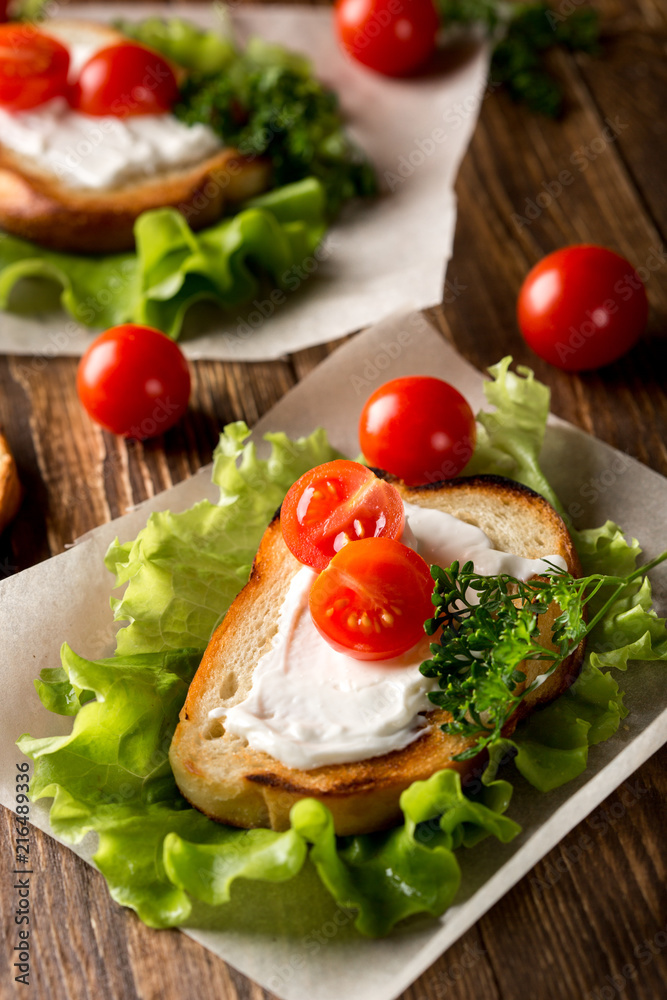 Homemade Burger with tomatoes and lettuce. Fast food. Homemade Burger with tomatoes and lettuce. Fast food.