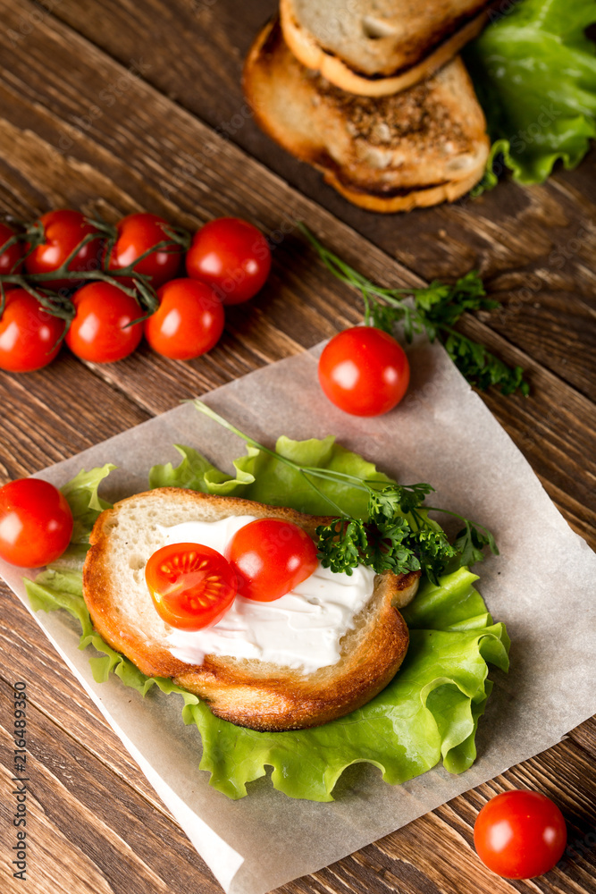 Homemade Burger with tomatoes and lettuce. Fast food. Homemade Burger with tomatoes and lettuce. Fast food.