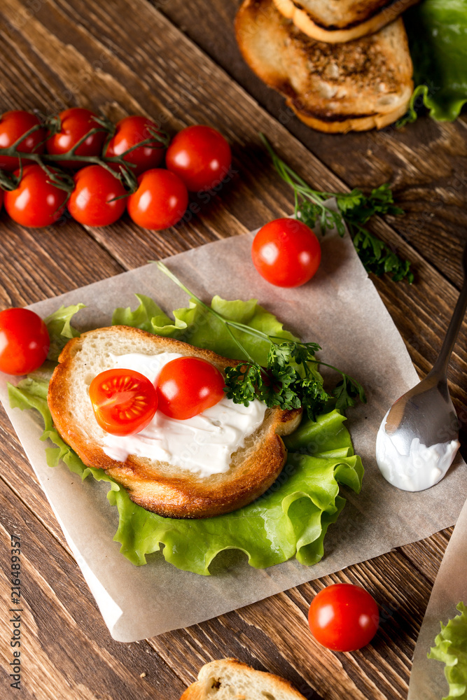 Homemade Burger with tomatoes and lettuce. Fast food. Homemade Burger with tomatoes and lettuce. Fast food.