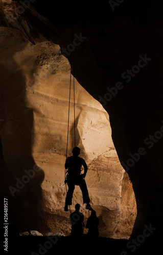 Silhouette of training alpinist in Luzit caves. Moshav Luzit, Ella Valley. Israel