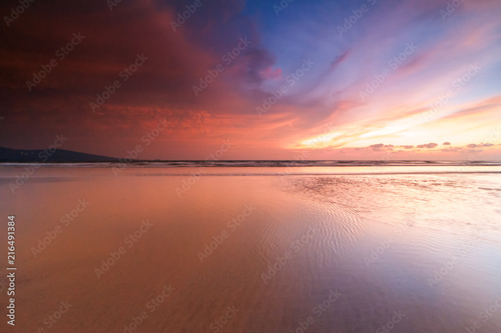 Fototapeta premium sunrise Seascape with beautiful reflection for background. soft focus due to long expose.