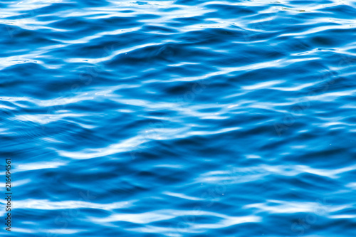 The texture and bright blue colour of the ocean water