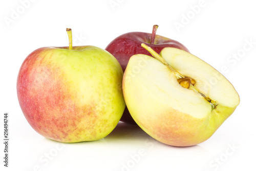 Group of two whole one half of fresh red apple james grieve variety isolated on white background