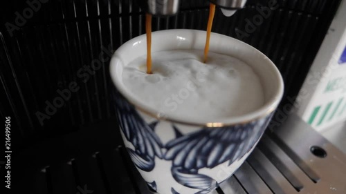 Coffe machine making cappuccino. photo