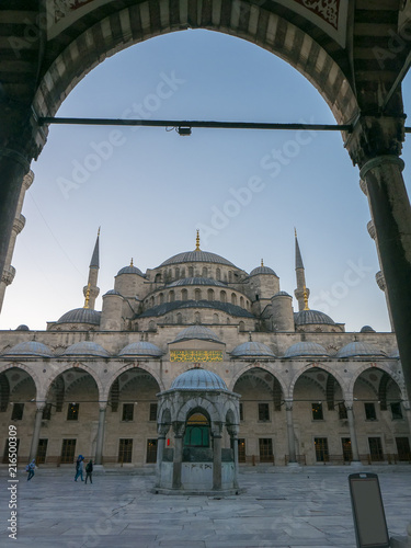 Courtyard of Sultanahmet (Blue mosque) in Istanbul, Turkey. Koranic words meaning the importance of prayer. photo