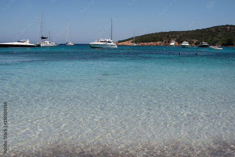 clear water with Boats in caprera Island, Sardinia, Italy