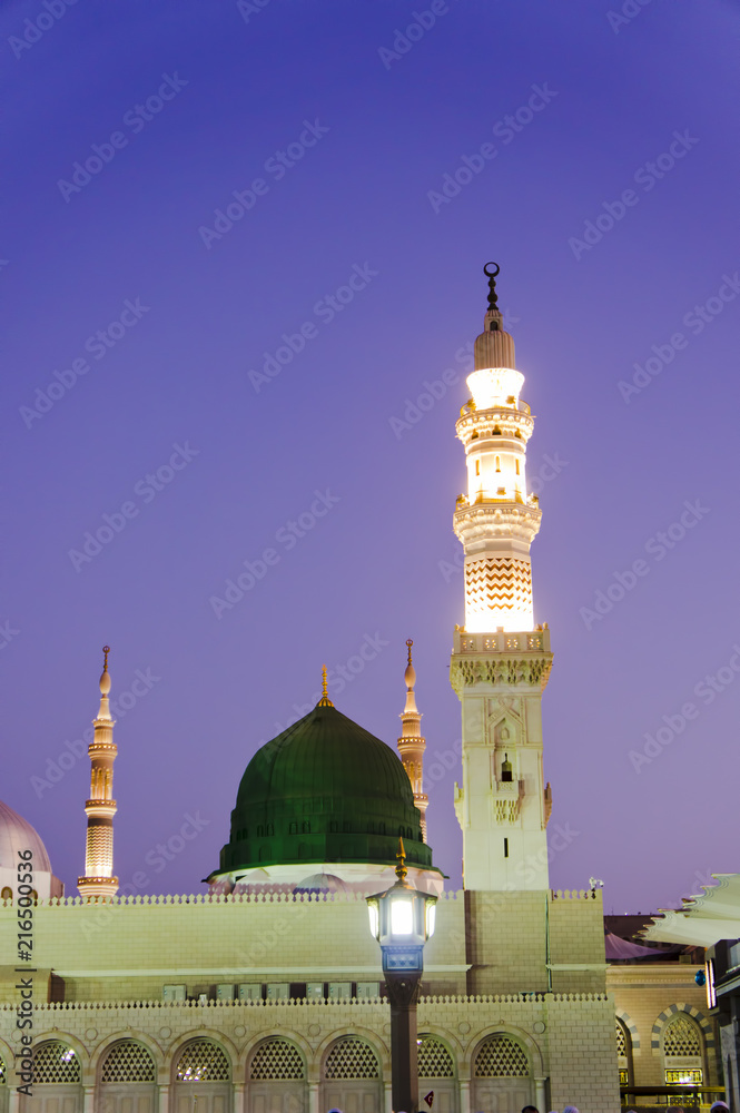 Masjid Al Nabawi or Nabawi Mosque (Mosque of the Prophet) at sunrise in  Medina (City of