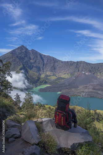 Man overlooking Rinjani mountain range, Lombok, Indonesia.