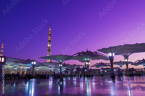 Nabawi mosque during sunrise golden hour.
