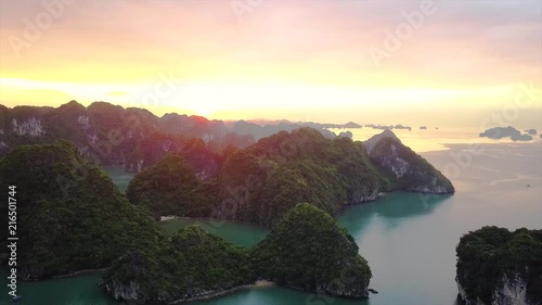 Aerial moving out shot of sunrise view at HaLong Bay, Vietnam photo