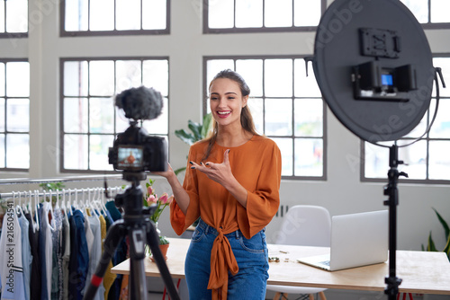 Social media entrepreneur recording daily vlog in studio photo