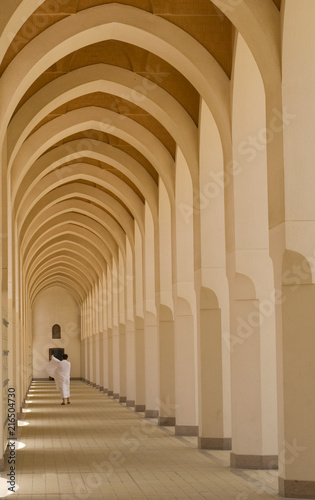 A pilgrim in ‘ihram’ cloth walks down a walkway in Medina. 'Ihram' clothes consist of two unhemmed white clothes intended to make everyone appears the same.