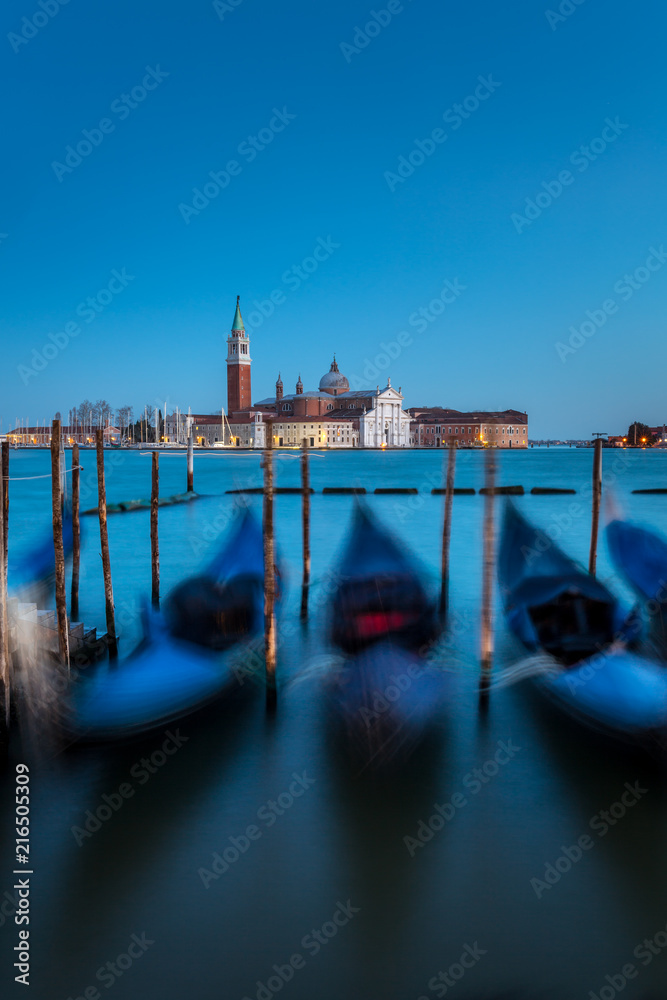 San Giorgio Maggiore church and gondolas at twilight in Venice, Italy.