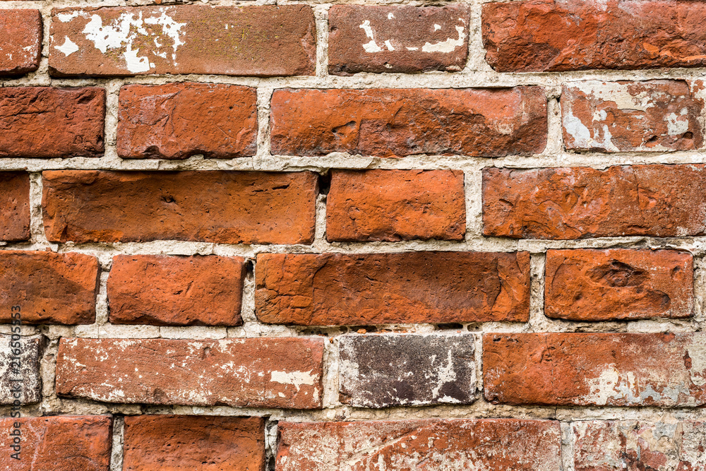 Crumbling old red brick wall, texture Crumbling old red brick wall, texture