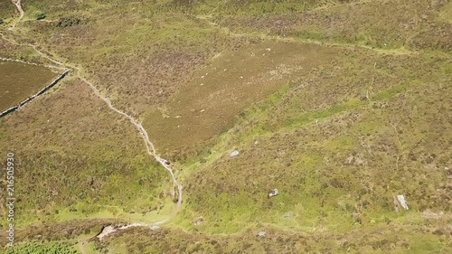 Aerial view of dirt road cutting through Dartmoor National Park, England. photo