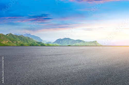 Empty asphalt square and mountain natural scenery © ABCDstock