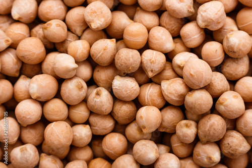 uncooked chickpeas on a white acrylic background