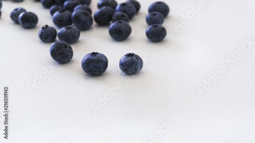 Blueberries and cranberries, berries on a white background. Berry light background.