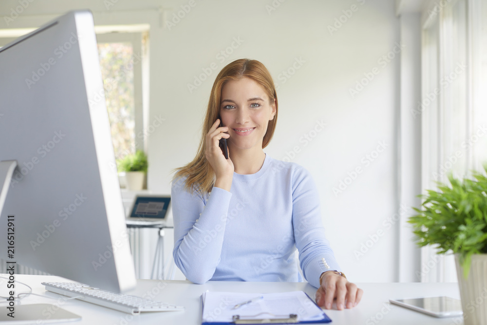 Businesswoman making call