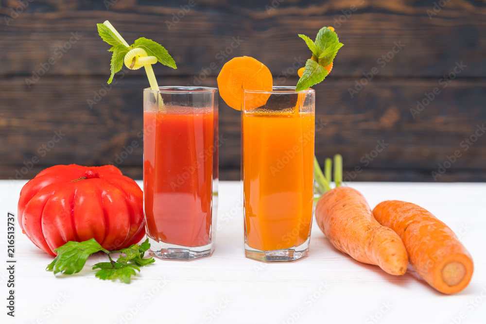 Fresh colorful healthy tomato and carrot smoothies