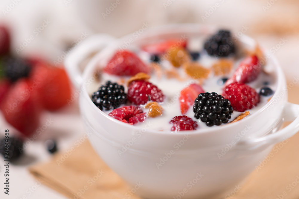 Bowl with fresh juicy fruits in yoghurt Bowl with fresh juicy fruits in yoghurt