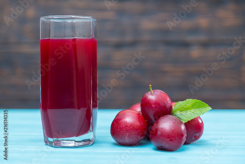 Freshly squeezed plum juice in a tall glass