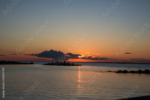 Sunsets in summer with thunderstorms brewing in Long Island Sound, New York photo