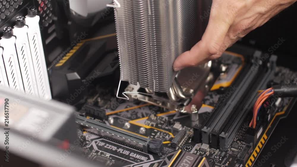 Professional man repairing and assembling a computer desktop