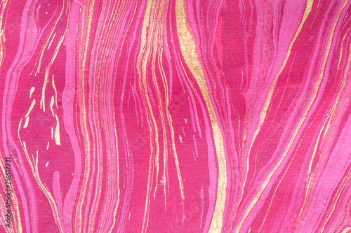 Recycled craft rough handmade red and gold paper textured abstract background. Art eco friendly kraft hand made pink batik paper natural material for Christmas New year  Valentine decoration.