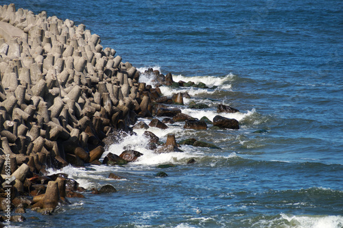 Sandy sea beach and sea waves