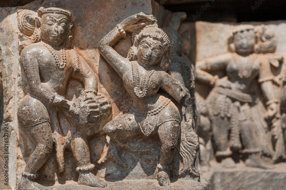 Example of indian artworks from near 12th century, dancers and musician on wall of Hindu temple, Halebidu, India