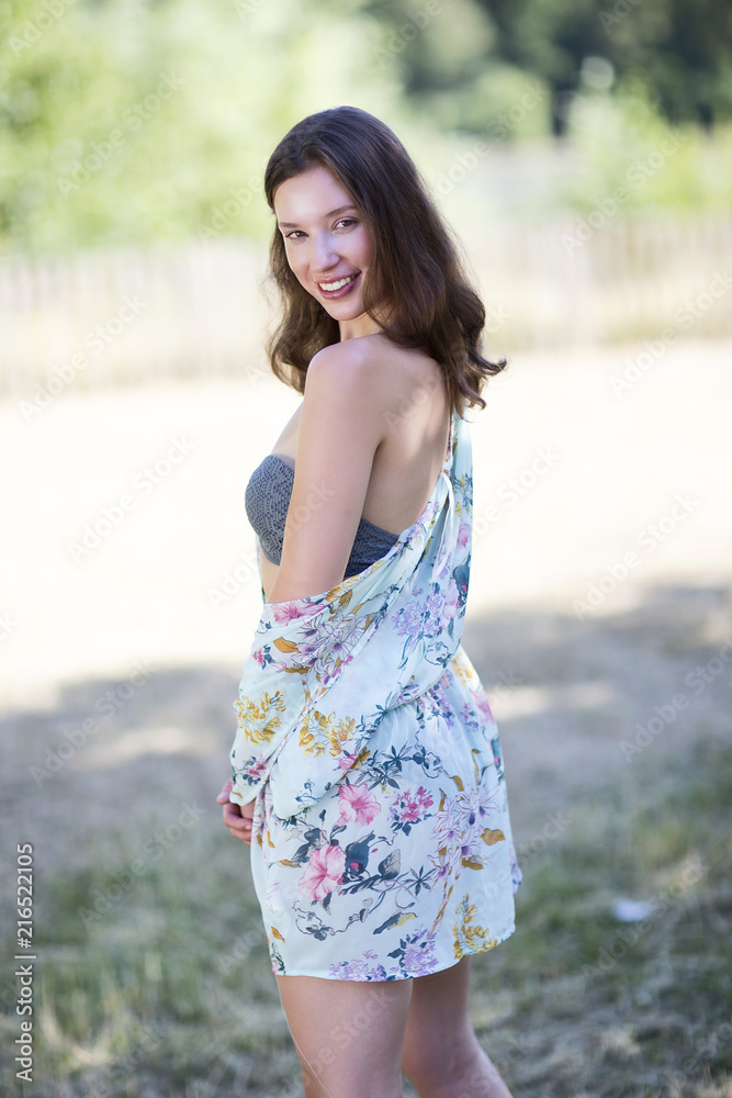 cute young woman wearing summery clothes looking happy cute young woman wearing summery clothes looking happy
