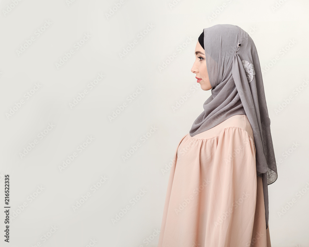 Profile portrait of traditionally dressed arabic woman in hijab Profile portrait of traditionally dressed arabic woman in hijab