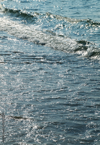 Sandy sea beach and sea waves