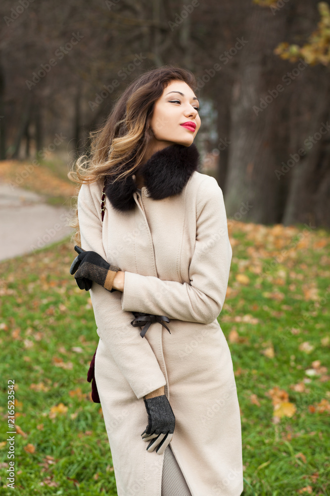 Portrait of a young beautiful woman in beige coat Portrait of a young beautiful woman in beige coat