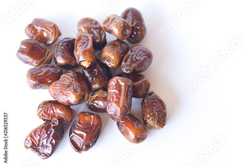 dried dates isolated on white background. selective focus.