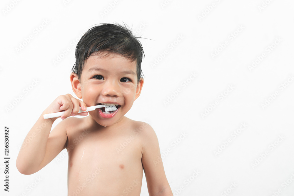 Little asian Boy brush teeth on white background. Little asian Boy brush teeth on white background.