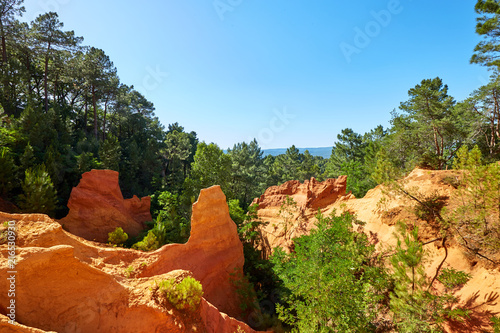 Red ocher cliffs in the village of Roussillon in Provence, Franc