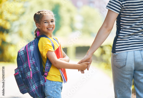 Parent and pupil go to school