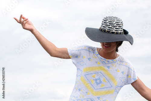 Cheerful guy in a female hat