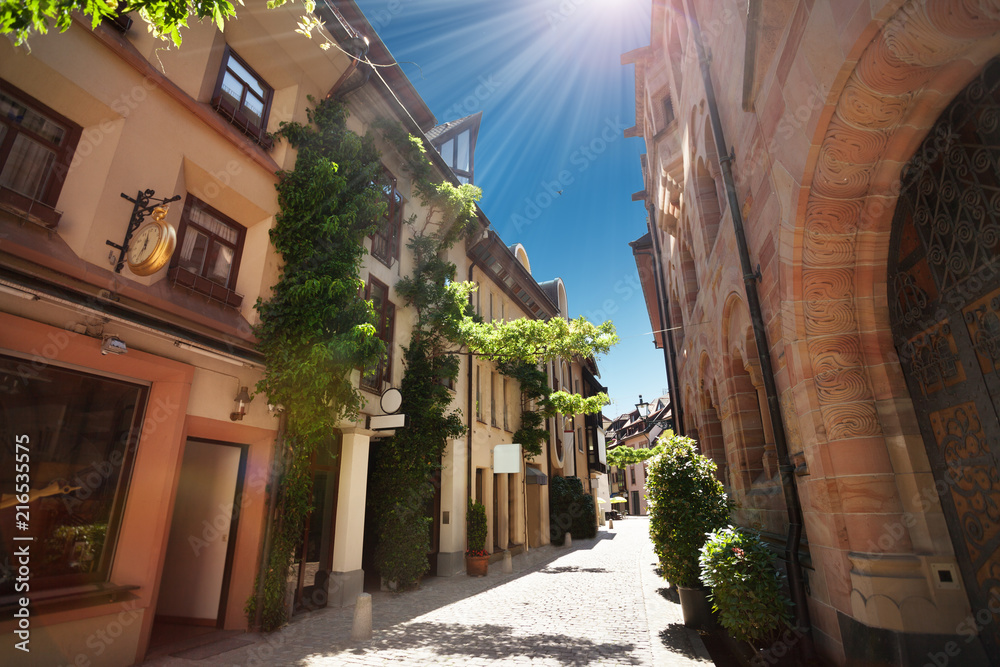 Narrow street of Freiburg im Breisgau at sunny day