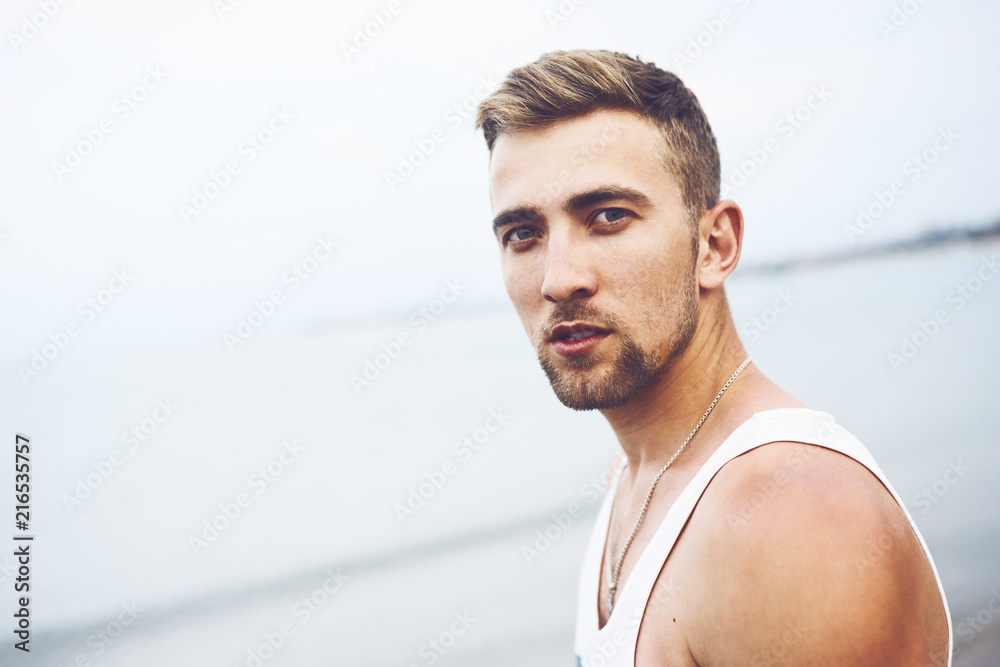Outdoor lifstyle portrait with young handsome guy