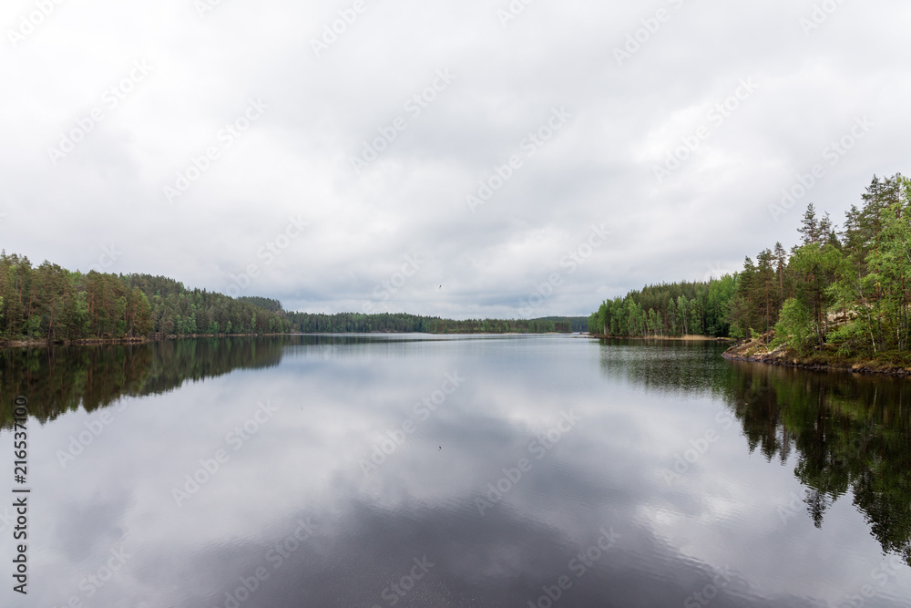 Peaceful lake in finnish lapland with some dark clouds