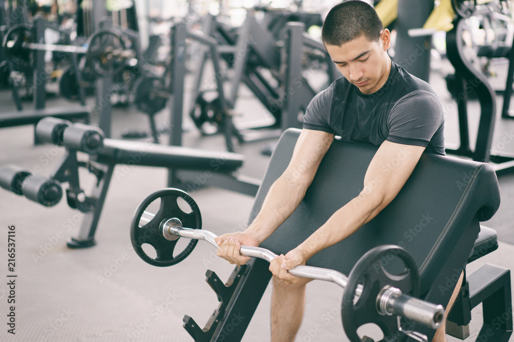 Asian man exercising in the gym, fitness, health, body good. Asian man exercising in the gym, fitness, health, body good.