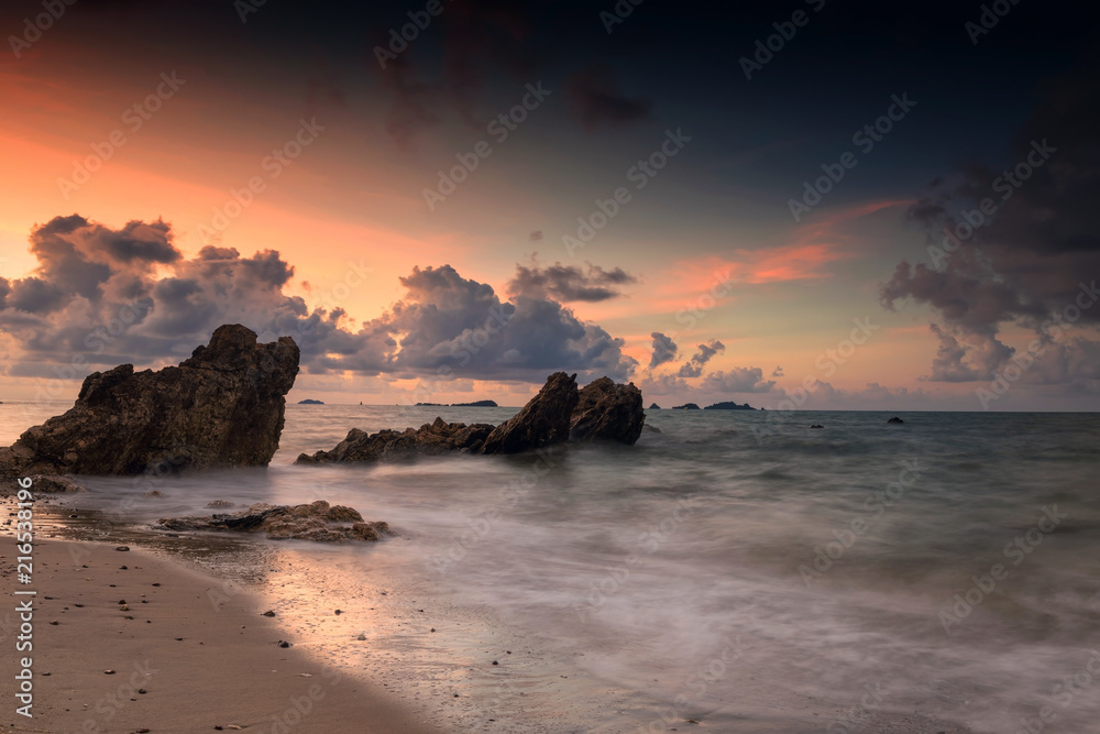 Seascape with natural stone arch at dawn