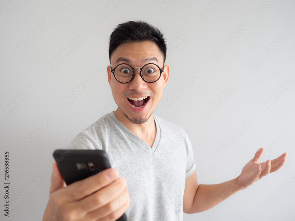 Man happy to see what in the smartphone. Man happy to see what in the smartphone.