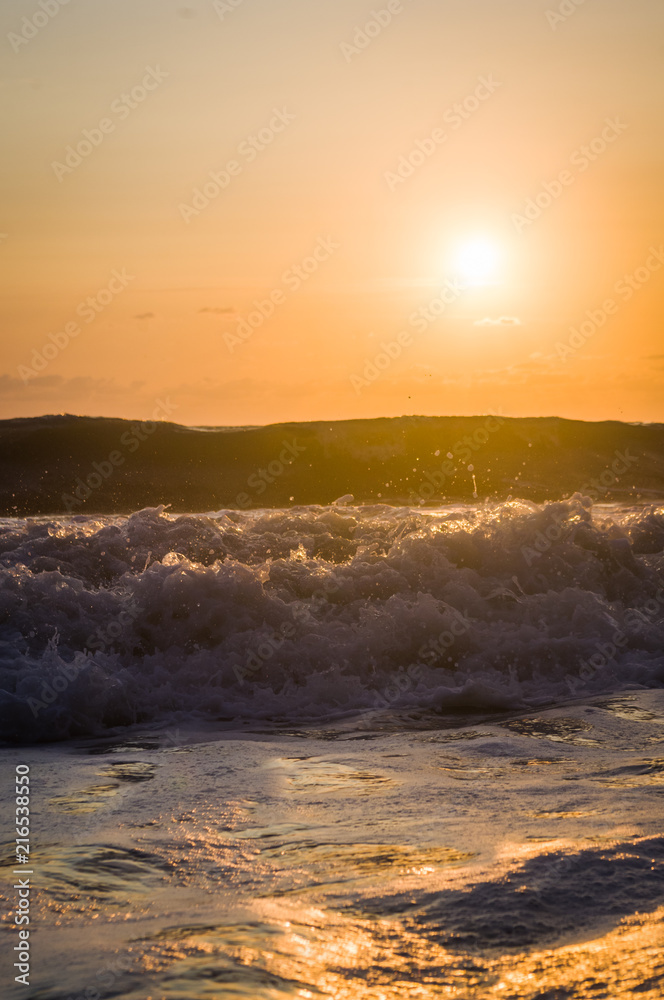 Fototapeta premium Amazing sea sunset, the sun, waves, clouds