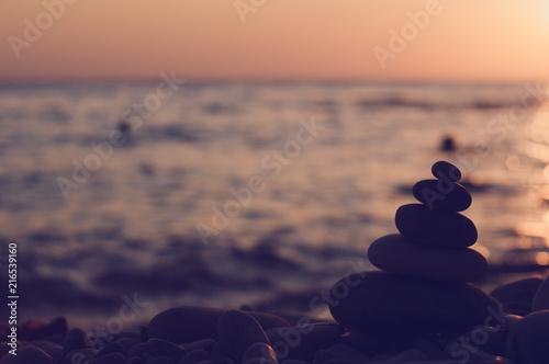 stack of zen stones on pebble beach