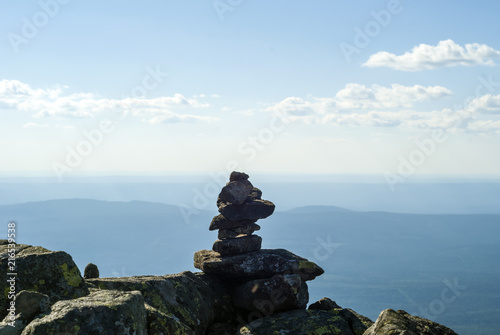 stone pyramid - a road sign on the mountain pass, reminiscent of a primitive sculpture photo